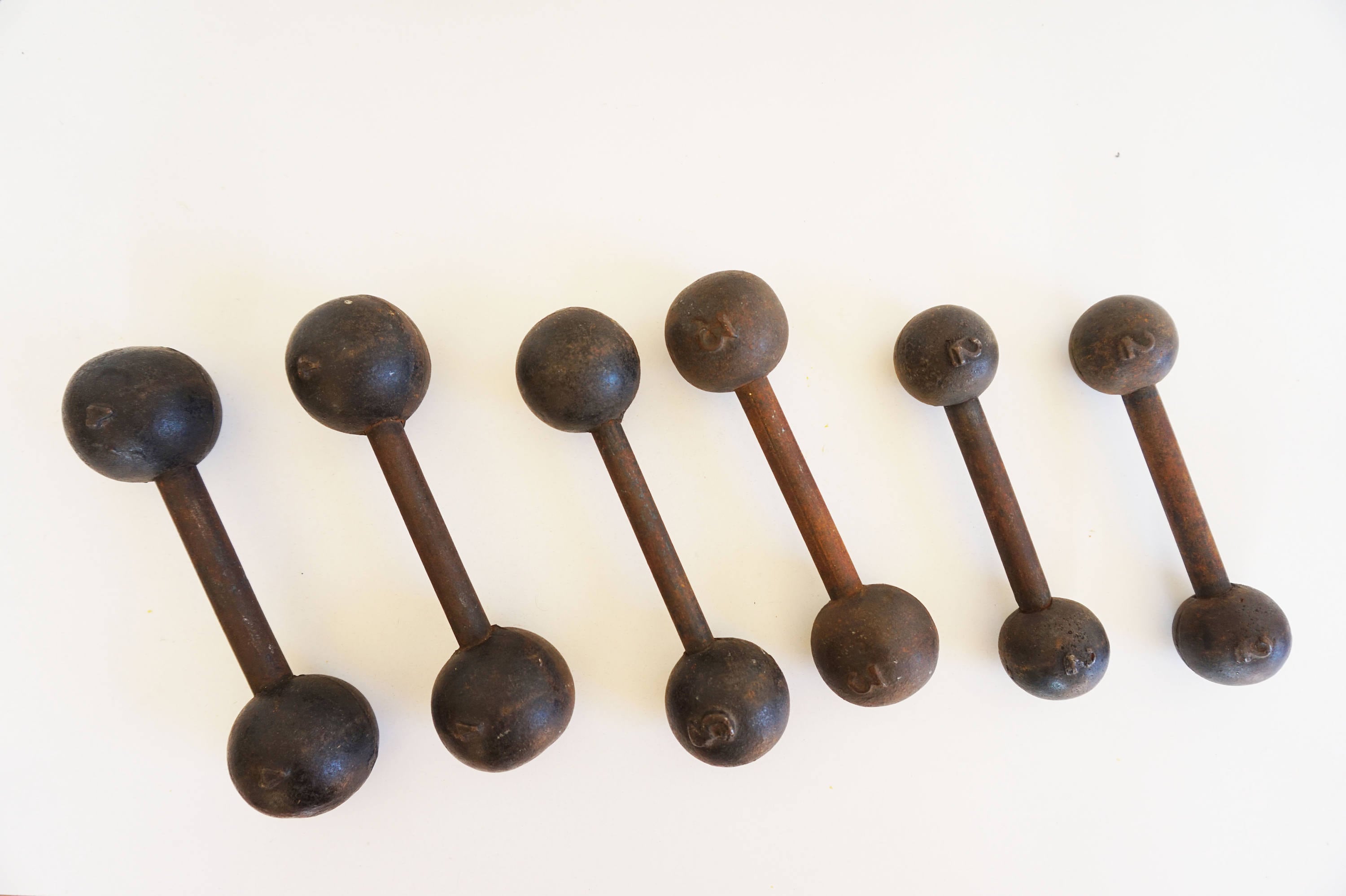 Pair of vintage cast iron dumbbells in the 1930s