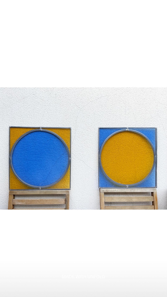 Pair of antique blue and yellow stained glass windows