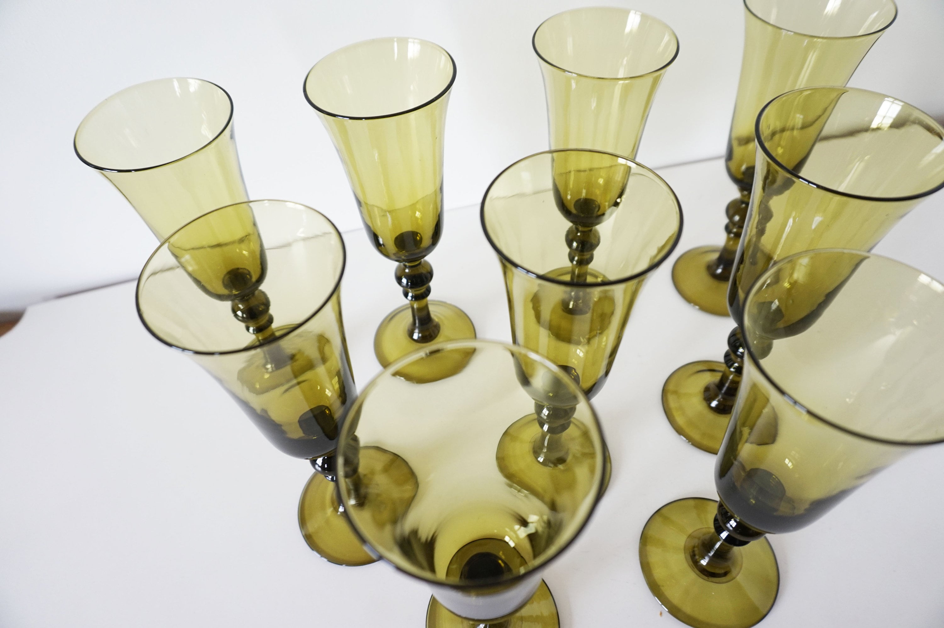 Lot of 9 vintage champagne flutes in olive green blown glass