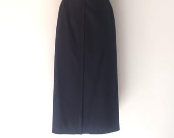 May include: A dark blue midi skirt with a straight cut and a simple design.