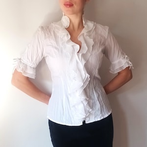 white shirt with frill sleeves