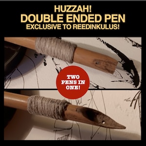 May include: A double-ended pen with a brown wooden body and a gray string wrapped around the middle. The pen has two nibs, one at each end. The text "TWO PENS IN ONE!" is written in red on a white circle.