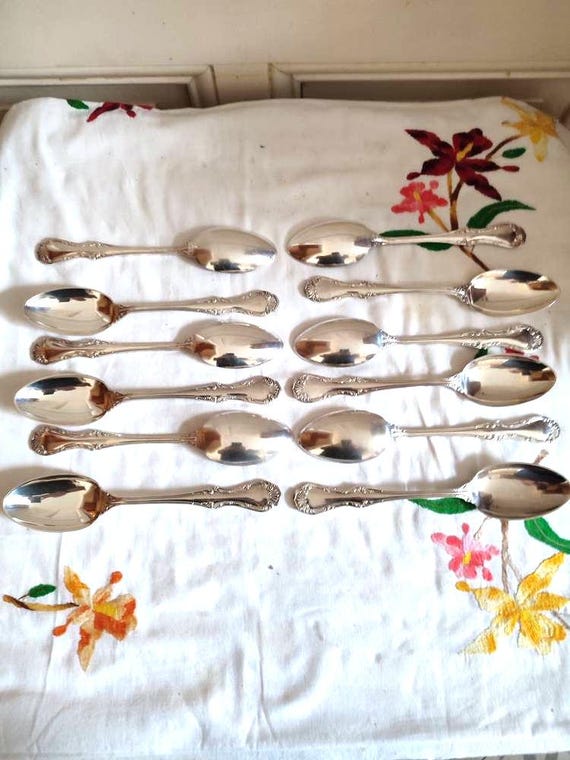 Mappin & Webb twelve soup spoons silver plated with plant scrolls decoration