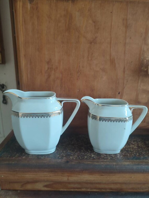 Singer two porcelain creamers or milk pots from Limoges France 1950s