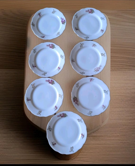 Beautiful set of seven small Russian earthenware dessert plates with pretty floral decoration and gilding