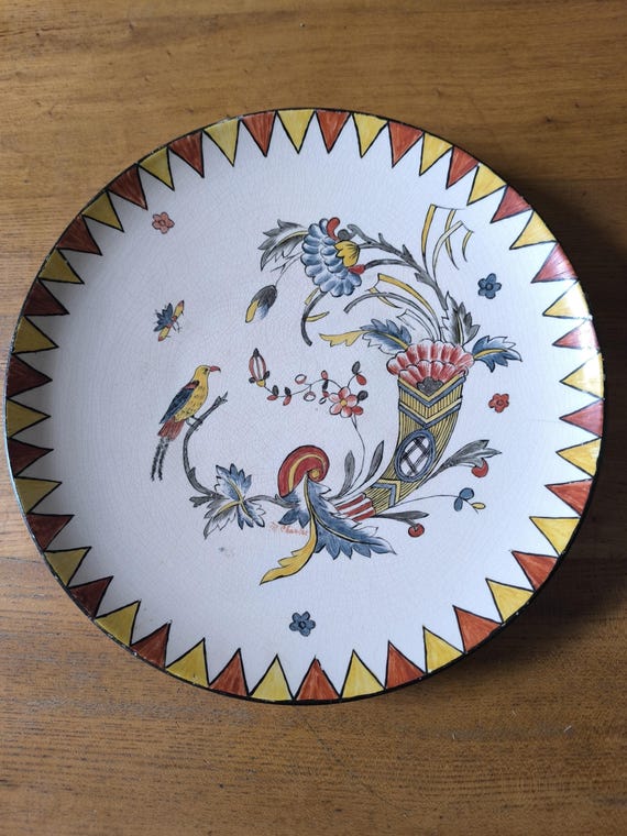 M CHARLET hollow earthenware dish decorated with cornucopia bird and insect French earthenware