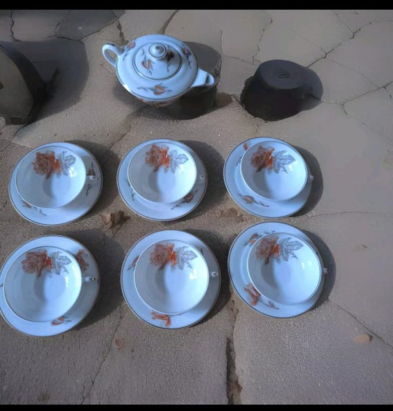 André Giraud & Cie part of tea service six cups and saucer jug in Limoges porcelain French porcelain
