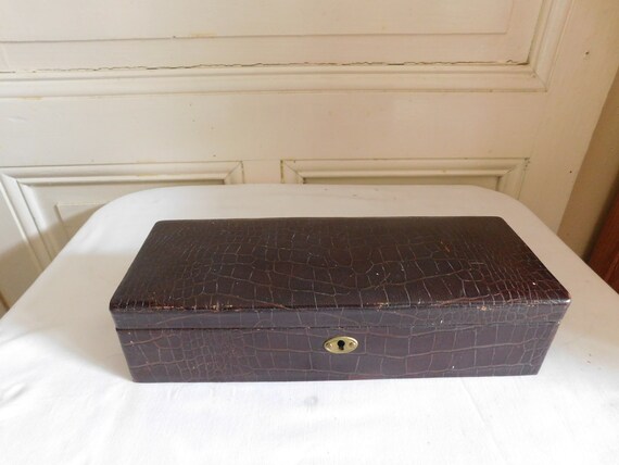 Old glove box wrapped in brown leather interior upholstered leather Renard