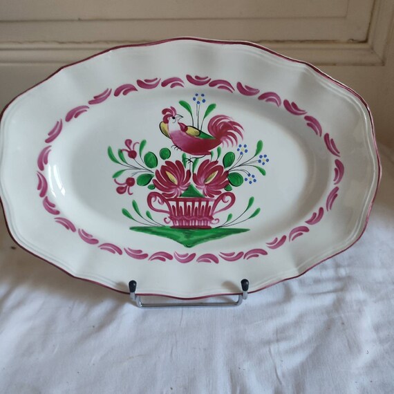 Small oval earthenware dish from St Clément model Chanteclerc decoration with rooster flower basket French earthenware