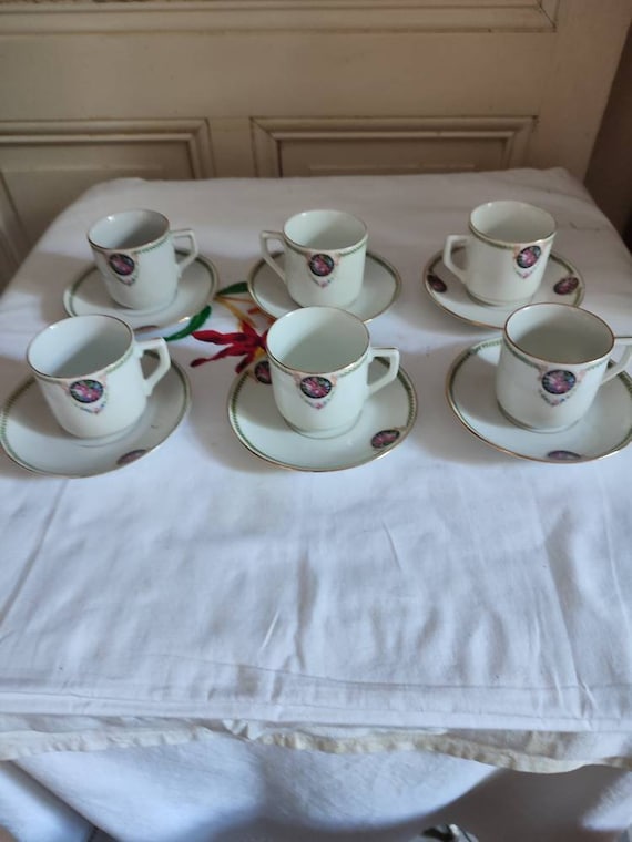 Porcelain coffee serving part six cups and under cups floral decoration including roses