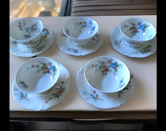 Former Royal Limoges Porcelain Factory, part of a six-cup and saucer French porcelain coffee service with floral decoration