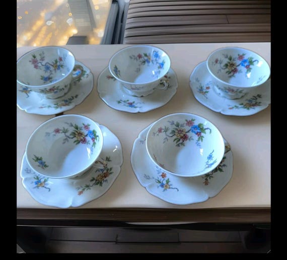 Former royal factory Limoges part of a porcelain coffee service, six cups and saucers, French porcelain, floral decoration
