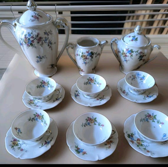 Former royal factory Limoges porcelain coffee service, jug, sugar bowl, creamer and six cups, French porcelain, floral decoration