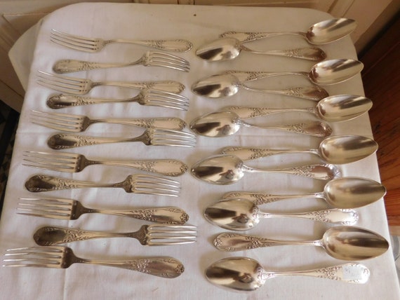SFAM suite of twelve spoons and eleven forks of art nouveau table silver metal French goldsmithing