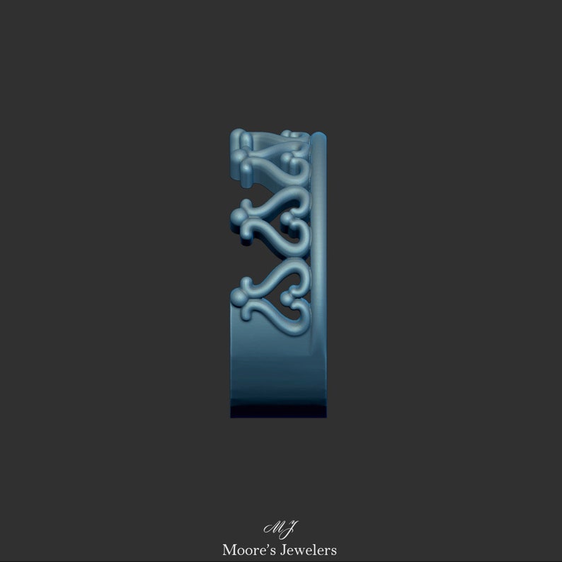 May include: Side view of a silver ring with a decorative design of interlocking hearts and swirls.
