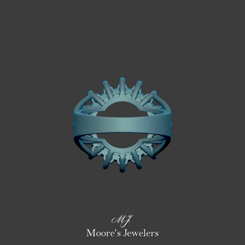 May include: A silver ring with a large, round, center stone surrounded by smaller stones. The ring is set in a halo style with a delicate band. The ring is shown from the bottom, revealing the setting and the band.