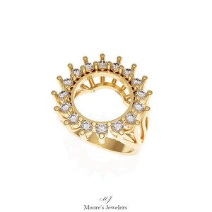 May include: A gold ring setting with a round center stone opening and a halo of small diamonds around the opening.