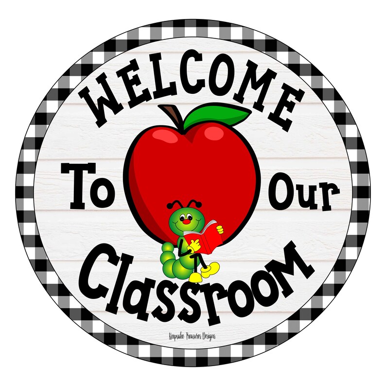 May include: Round classroom sign with a red apple and a green caterpillar reading a book. The sign says "WELCOME To Our Classroom" in black text. The border is a black and white checkered pattern.
