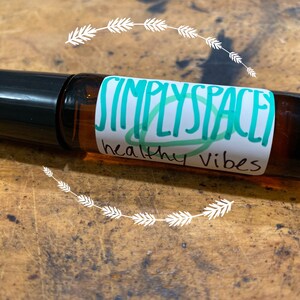 Healthy vibes essential oil blend in glass roller bottle