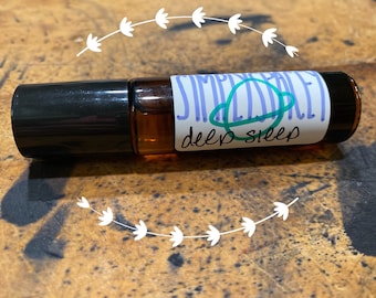 Deep sleep essential oil blend in glass roller bottle