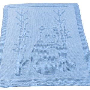 May include: A light blue knitted baby blanket featuring a panda bear design with bamboo stalks. The blanket has a square shape with a detailed border. The panda is in the center of the blanket.