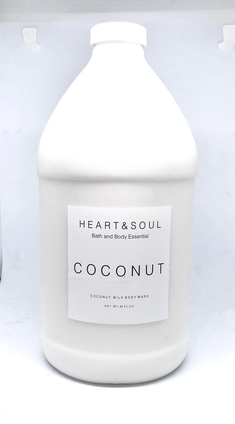 May include: A white plastic bottle with a white label that reads "HEART&SOUL Bath and Body Essential COCONUT COCONUT MILK BODY WASH NET WT. 64 FL.OZ".