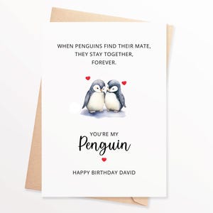 May include: A white card with a watercolor illustration of two penguins with red hearts. The text reads "When penguins find their mate, they stay together, forever. You're my penguin. Happy Birthday David."
