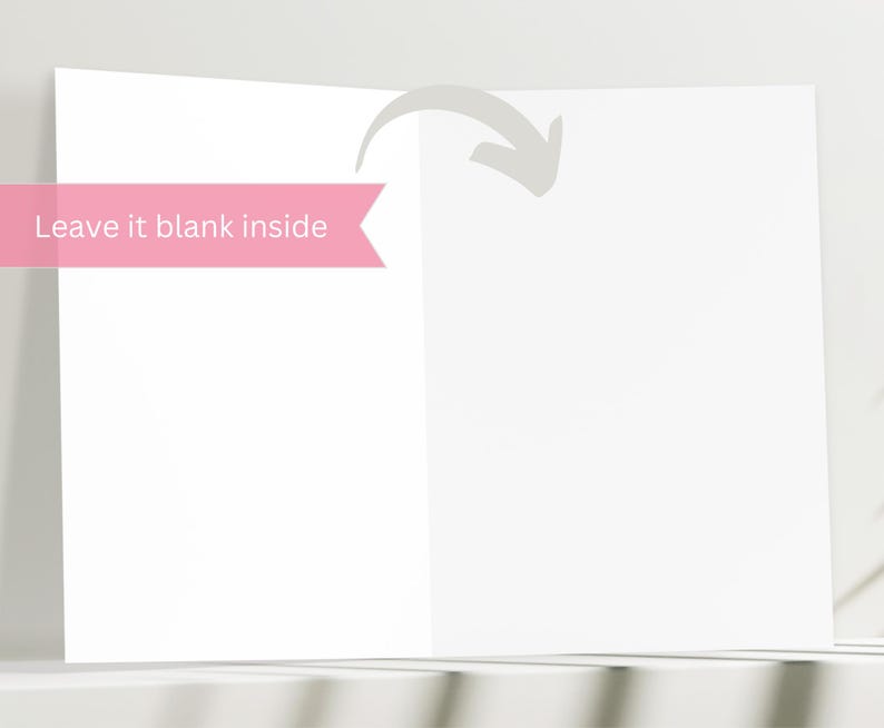 May include: A blank white card with a pink ribbon that says "Leave it blank inside".