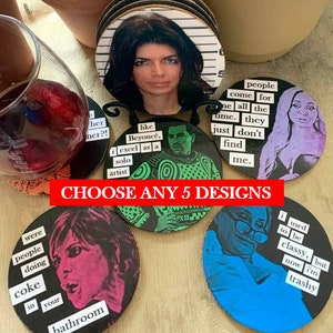May include: Set of 6 round coasters featuring colorful images and text. The coasters feature images of people with text overlays. The text includes phrases like "like Beyonc&eacute;, I excel as a solo artist" and "people come for me all the time. They just don't find me."