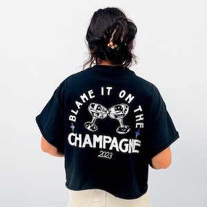 Blame It On The Champagne Bachelorette Party Cropped Shirt l Matching Bridal Party Tee l Bride Tribe Graphic T-Shirt l Wedding Party Gift