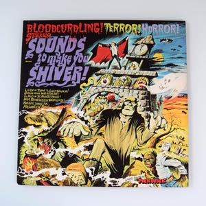 May include: A vintage vinyl record cover titled Bloodcurdling! Terror! Horror! Sounds to make you shiver! The cover features a colorful illustration of a vampire, a monster, a witch, and a haunted castle against a dark, spooky night sky.
