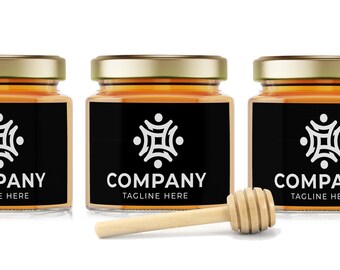 May include: Three glass jars filled with honey, each with a black label featuring a white geometric logo and the text "COMPANY TAGLINE HERE". A wooden honey dipper is in the foreground.