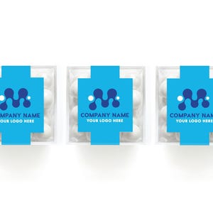 May include: Three square clear plastic boxes filled with white round candies. Each box features a bright blue paper band printed with a dark blue abstract wave logo and the text COMPANY NAME YOUR LOGO HERE in dark blue capital letters.