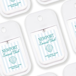 several white hand sanitizer dispensers with blue and white striped labels.