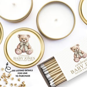 a collection of items related to baby showers, including teddy bears, candles, and matchsticks.