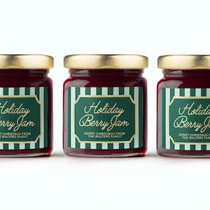 May include: Three glass jars of Holiday Berry Jam with gold lids. Each jar has a green label with gold text that reads "Holiday Berry Jam" and "Merry Christmas from The Walters Family."