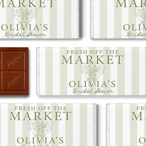 May include: Rectangular chocolate bars wrapped in white and sage green striped paper. The labels feature the text FRESH OFF THE MARKET and OLIVIA'S Bridal Shower, accompanied by a line art illustration of a flower bouquet in the center.