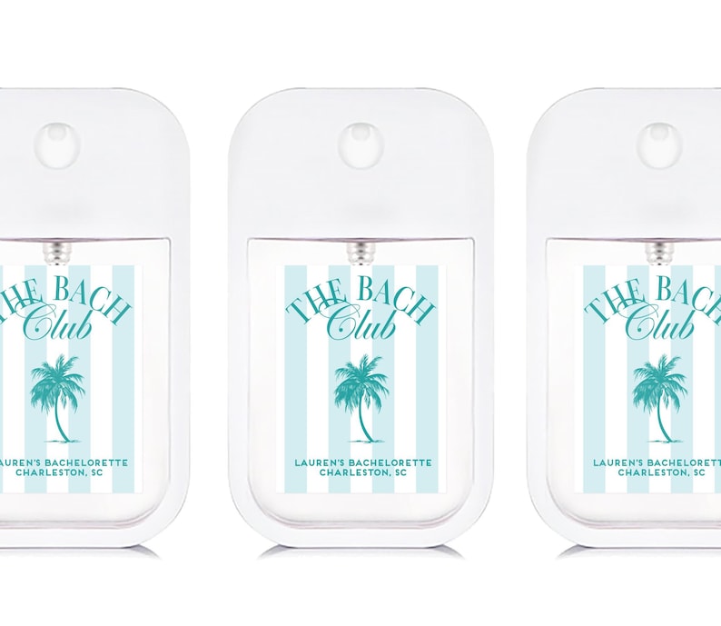 three identical white spray bottles with blue and green labels, each featuring the text "THE BACH CLUB" and "LAUREN'S BACHLONERTE CHAPELON, SC".