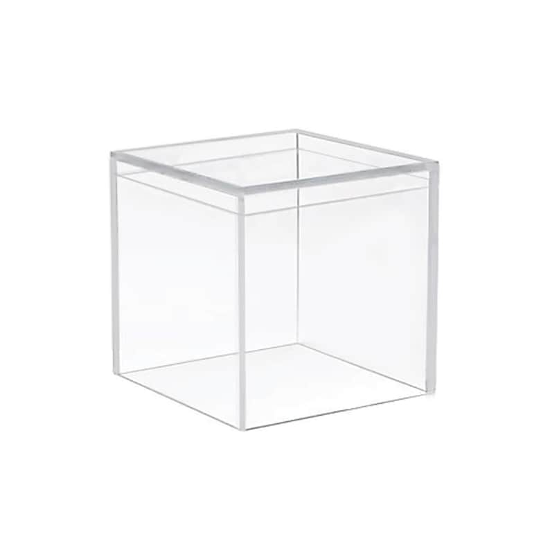 May include: A clear plastic cube-shaped box with a lid. The box is empty.