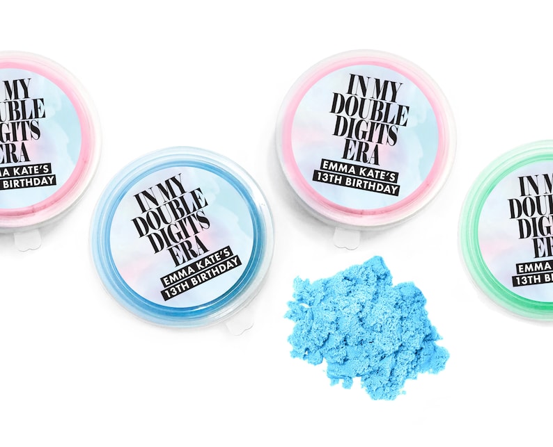 May include: Three small containers of blue, pink, and green slime with labels that say "In My Double Digits Era" and "Emma Kate's 13th Birthday".