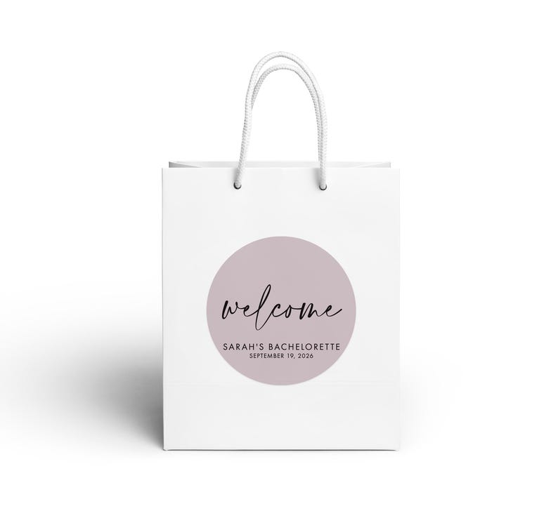 A white paper bag with a circular logo and text on it.