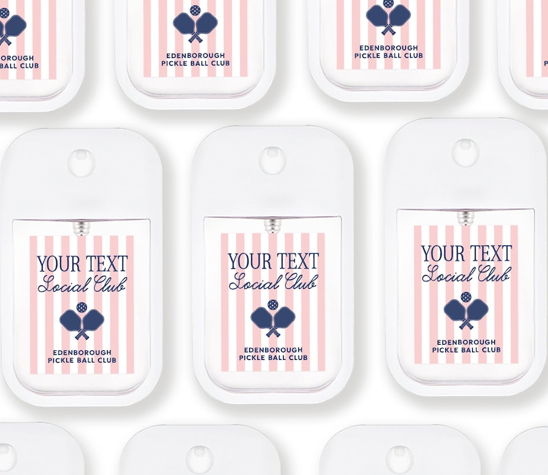 multiple white spray bottles with pink and blue stripes and text, all labeled with the same design.