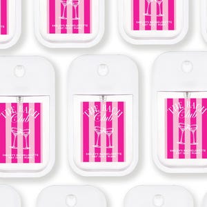 multiple white spray bottles with pink and white striped labels, each featuring the text "The Beach Club" and "Shelley's Bachelorette May 12, 2016 Miami".