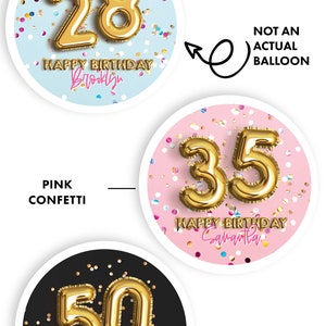 May include: Three round birthday party decorations with gold foil numbers, confetti, and a personalized name. The decorations are on a white background. The numbers are 28, 35, and 50. The confetti is blue, pink, and black.
