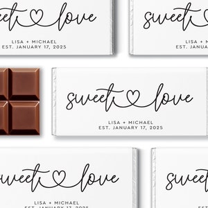 May include: White chocolate bar wrappers with the text "sweet love" and the names Lisa and Michael, along with the date January 17, 2025.