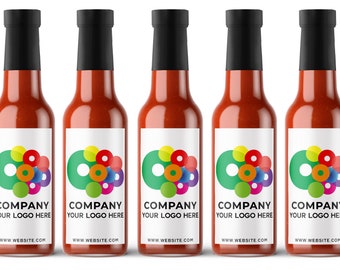 May include: Five glass bottles of hot sauce with red liquid and white labels. The labels have a colorful logo with a circle and smaller circles inside. The text on the labels reads "COMPANY YOUR LOGO HERE WWW.WEBSITE.COM".