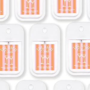 multiple white spray bottles with orange and pink striped labels, each featuring a graphic of two champagne glasses and the text "The Bach Club" and "Shelley's Bachelorette May 12, Miami".