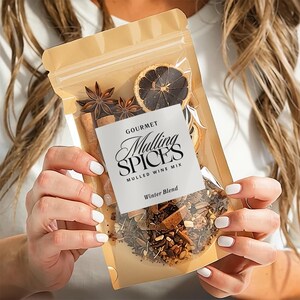 May include: A clear, resealable bag filled with mulling spices, including star anise, cinnamon sticks, and dried orange slices. The bag has a white label that reads "Gourmet Mulling Spices, Mulled Wine Mix, Winter Blend."