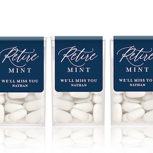 May include: Five clear plastic containers filled with white mints. Each container has a blue label with white text that reads "Retire Mint" and "We'll Miss You Nathan".
