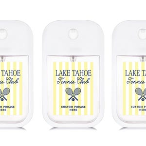 Three identical hand sanitizer dispensers with the text "Lake Tahoe Tennis Club" printed on them.